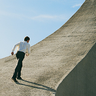 Illustration: A man running up a hill